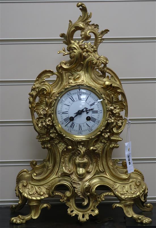 A Louis XV style gilt brass eight day mantel clock